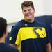 Michigan offensive lineman Taylor Lewan smiles as he speaks during a press conference at the Al Glick Fieldhouse on Monday, August 5, 2013. Melanie Maxwell | AnnArbor.com